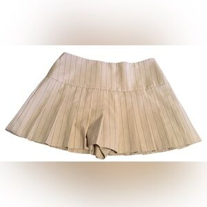 Zara Pleated Skort features a high waist, wrap front, side buckle, pleat details